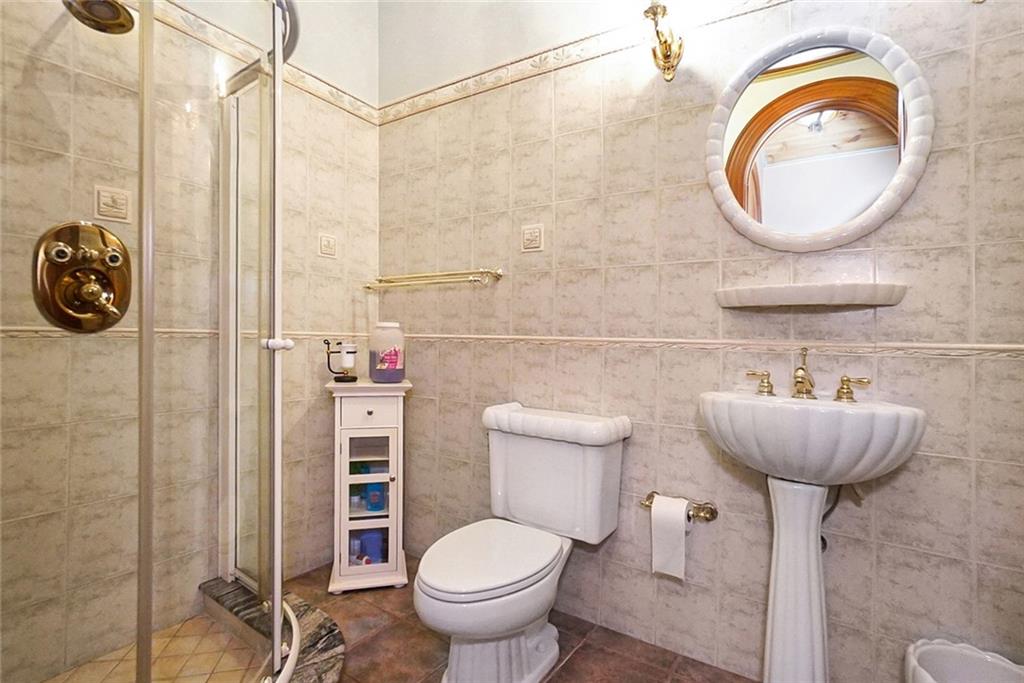 1406 73rd Street Brooklyn, NY 11228 - Photo 30 of 42 a bathroom with a toilet and a sink