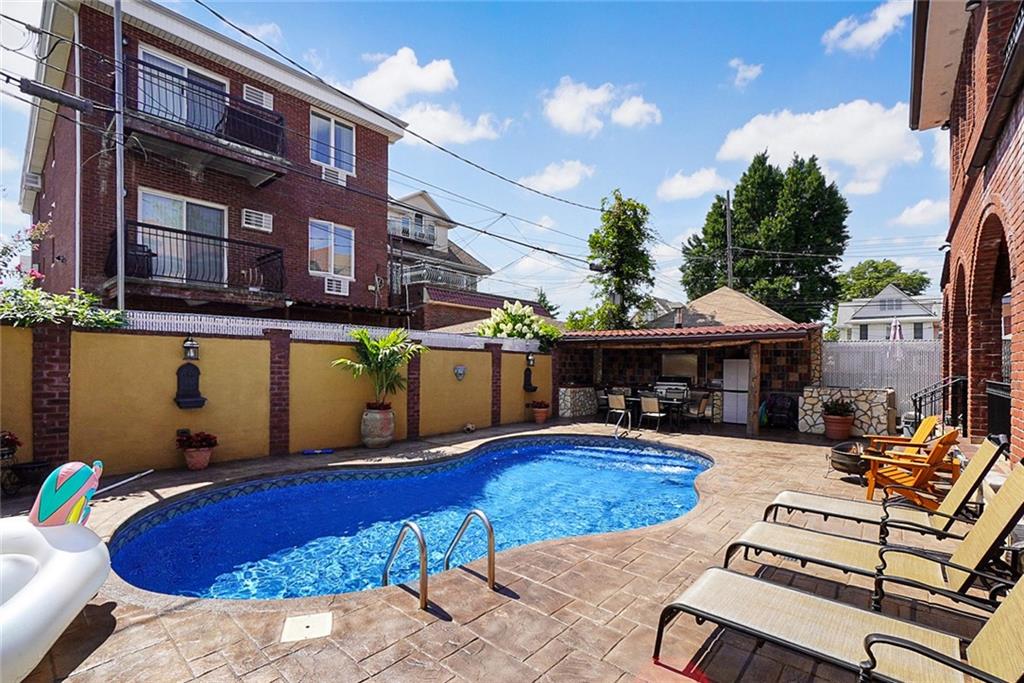 1406 73rd Street Brooklyn, NY 11228 - Photo 4 of 42 a view of swimming pool with outdoor seating