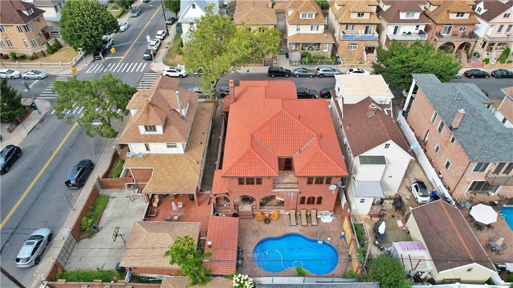 1406 73rd Street Brooklyn, NY 11228 - Photo 42 of 42 an aerial view of residential houses with outdoor space and parking