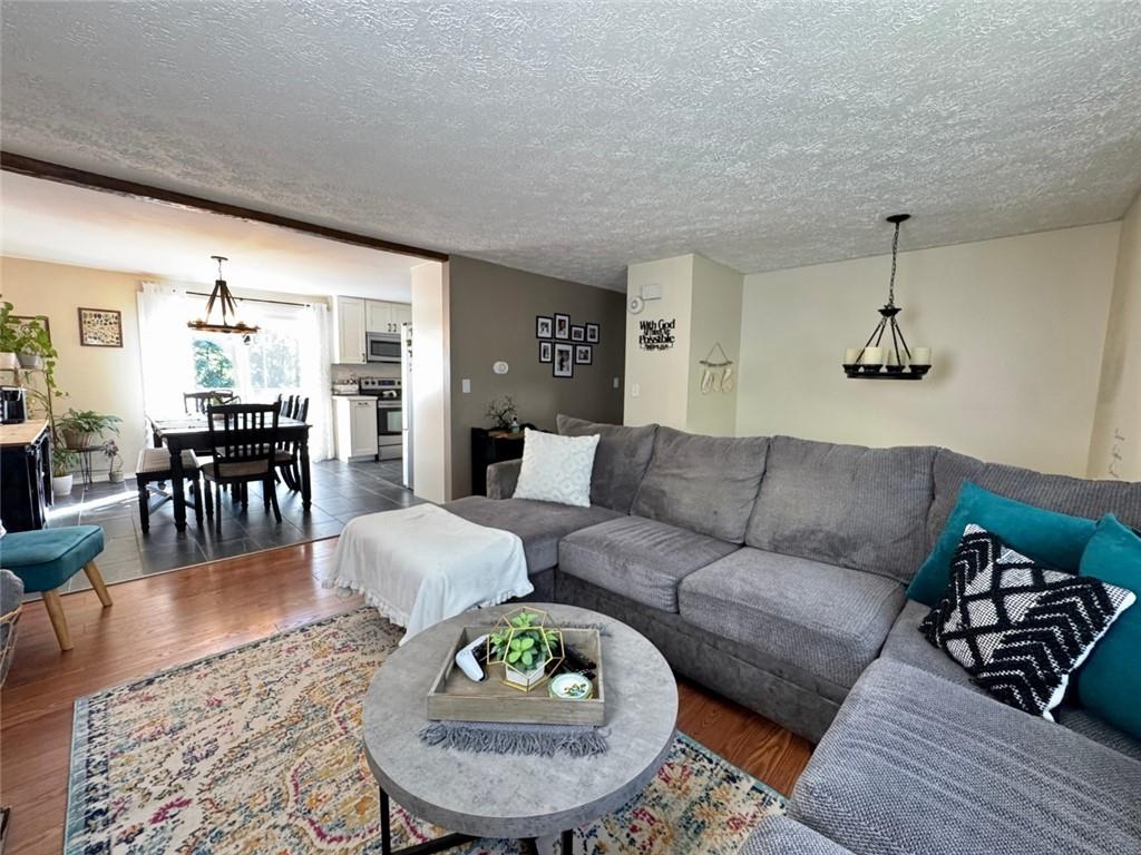 142 Partridge Run Road Gibsonia, PA 15044 - Photo 11 of 32 a living room with furniture and wooden floor