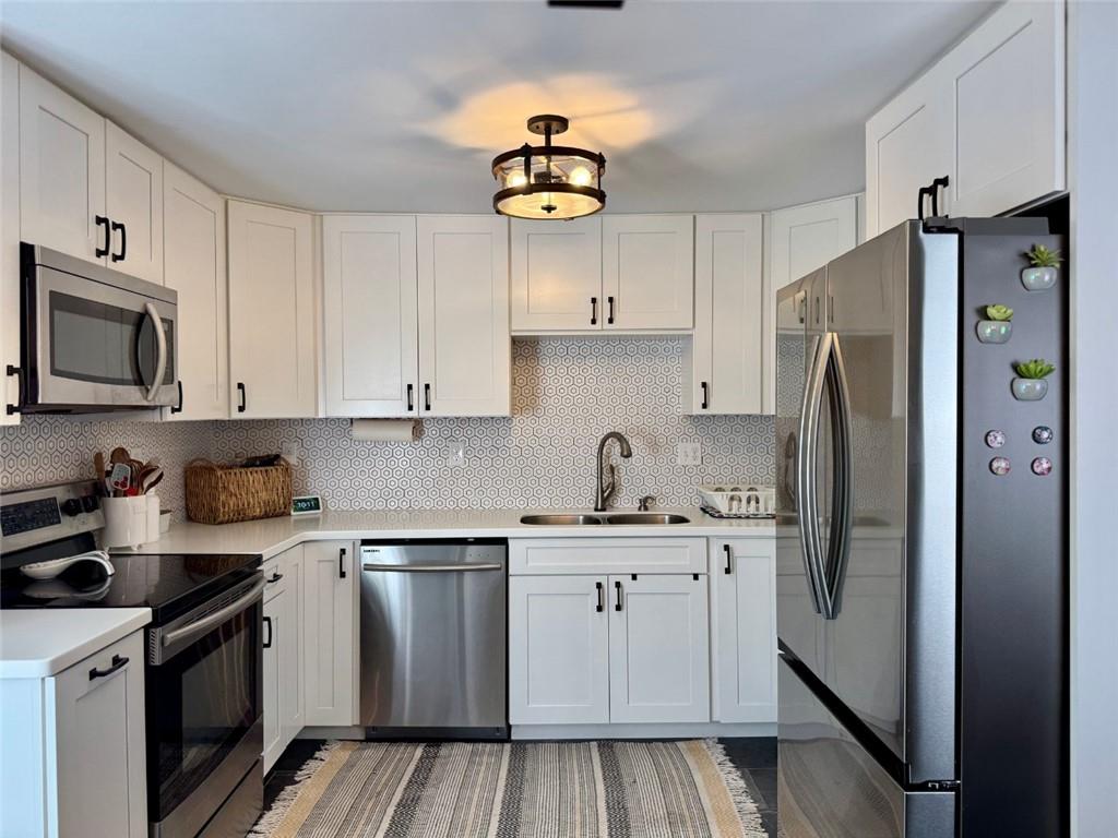 142 Partridge Run Road Gibsonia, PA 15044 - Photo 14 of 32 a kitchen with stainless steel appliances granite countertop a refrigerator sink and stove