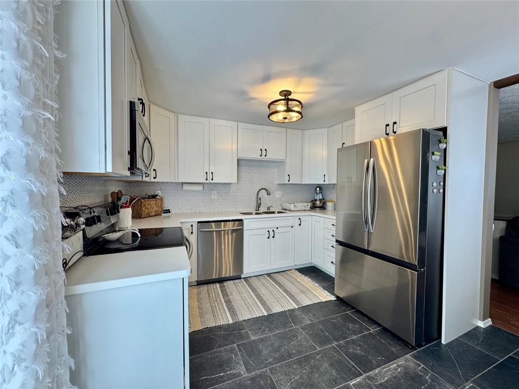 142 Partridge Run Road Gibsonia, PA 15044 - Photo 15 of 32 a kitchen with a refrigerator and a sink