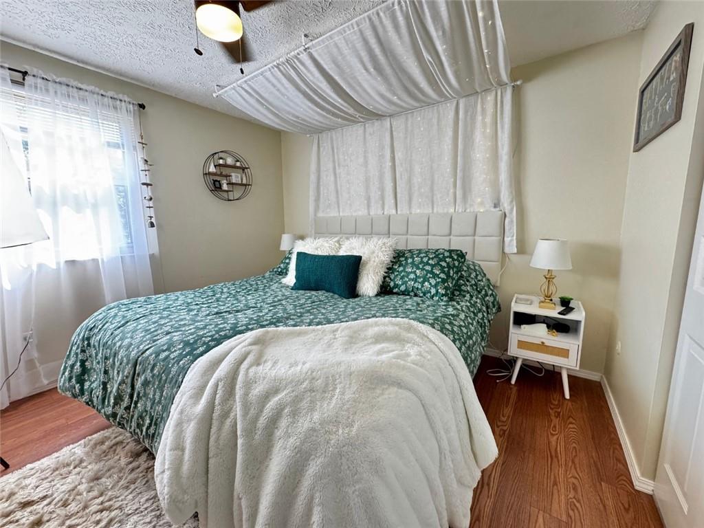 142 Partridge Run Road Gibsonia, PA 15044 - Photo 20 of 32 a bedroom with a bed and a chair