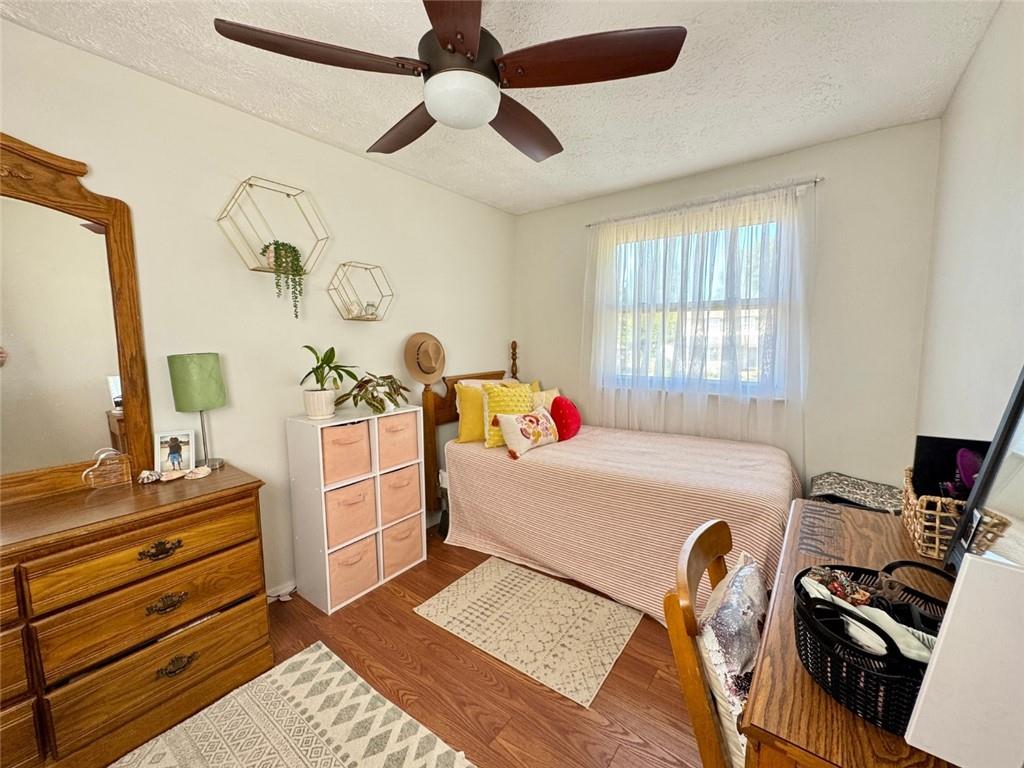 142 Partridge Run Road Gibsonia, PA 15044 - Photo 22 of 32 a bedroom with a bed and a chandelier