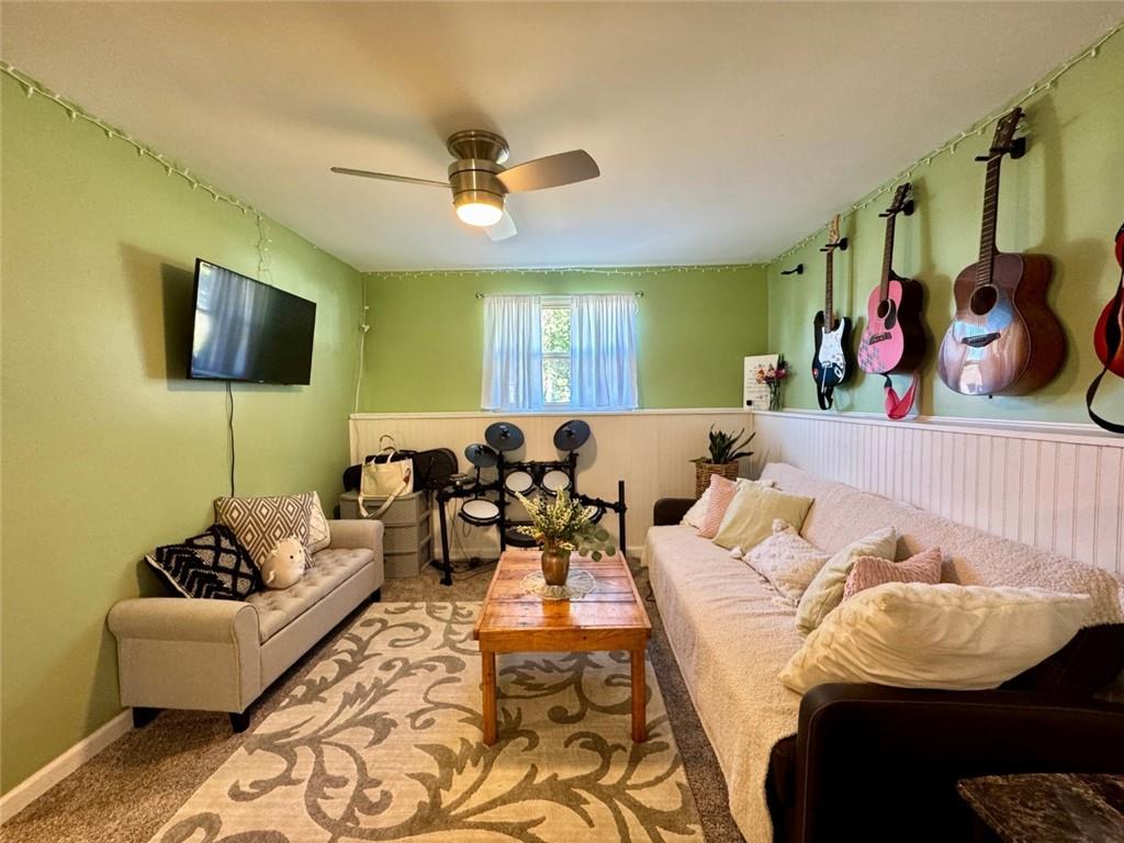 142 Partridge Run Road Gibsonia, PA 15044 - Photo 27 of 32 a living room with furniture and a flat screen tv