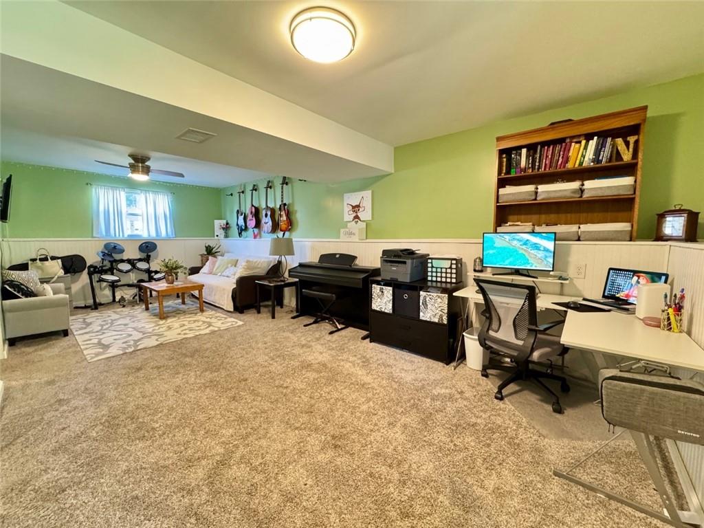 142 Partridge Run Road Gibsonia, PA 15044 - Photo 28 of 32 a living room with furniture a window and a flat screen tv