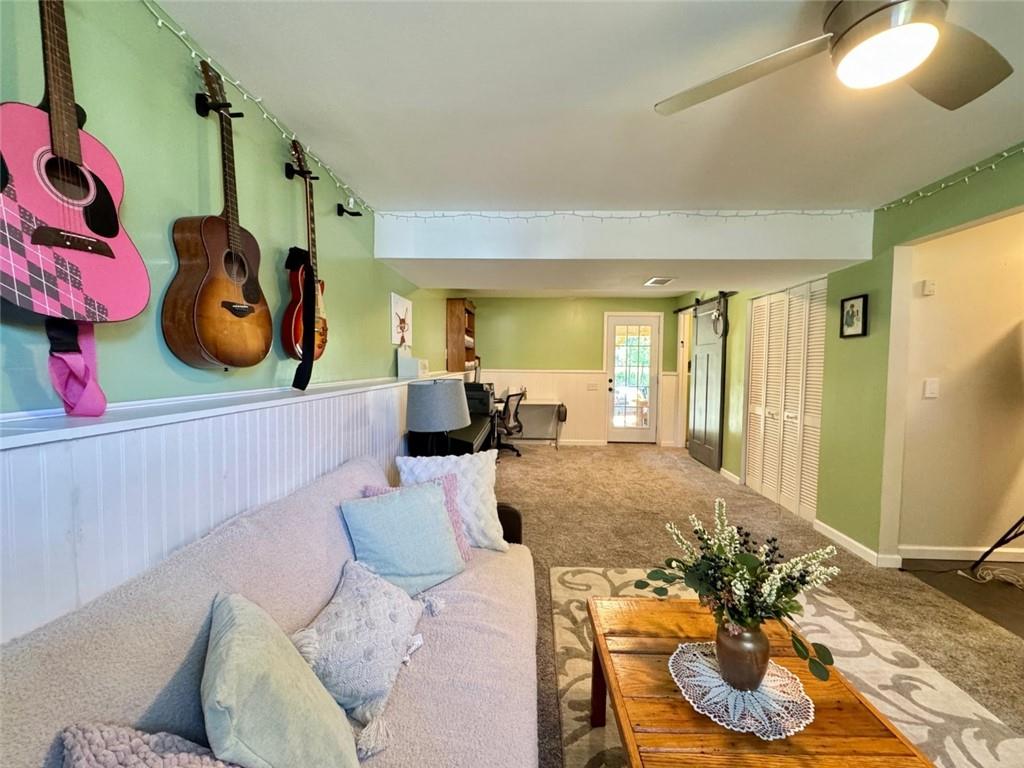 142 Partridge Run Road Gibsonia, PA 15044 - Photo 30 of 32 a living room with furniture and a wooden floor