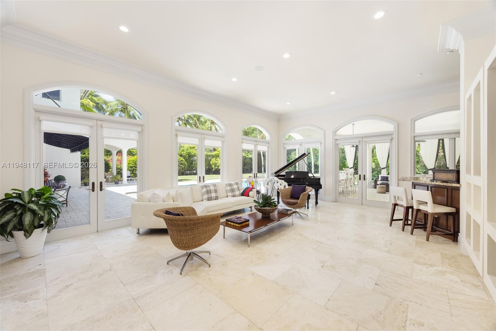 8252 School House Road Miami, FL 33143 - Photo 12 of 43 a living room with furniture and a potted plant