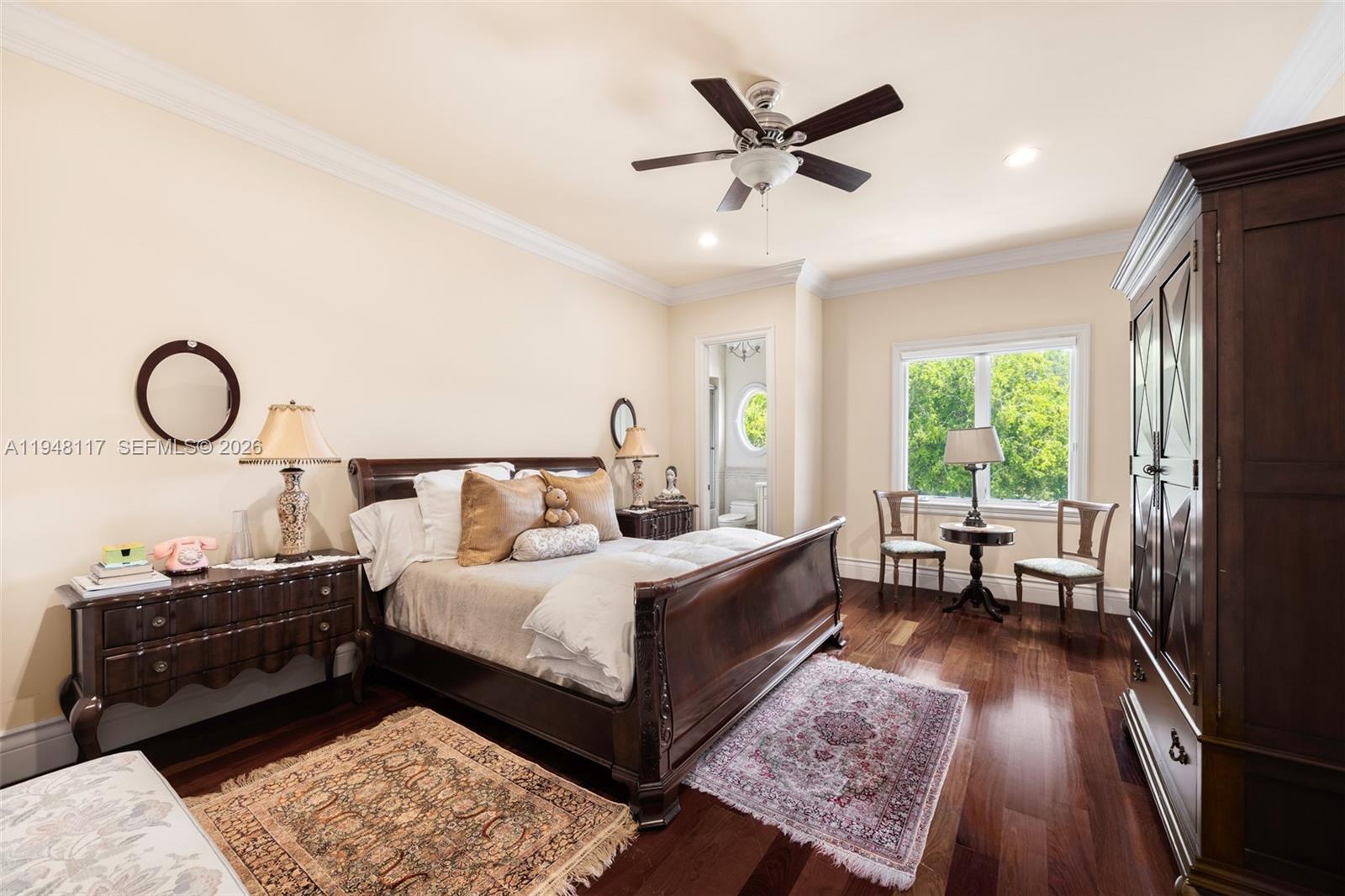 8252 School House Road Miami, FL 33143 - Photo 22 of 43 a bedroom with a bed and wooden floor
