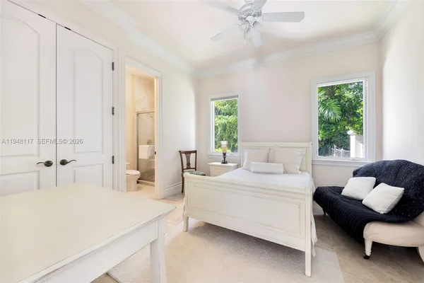a bedroom with a bed and a couch