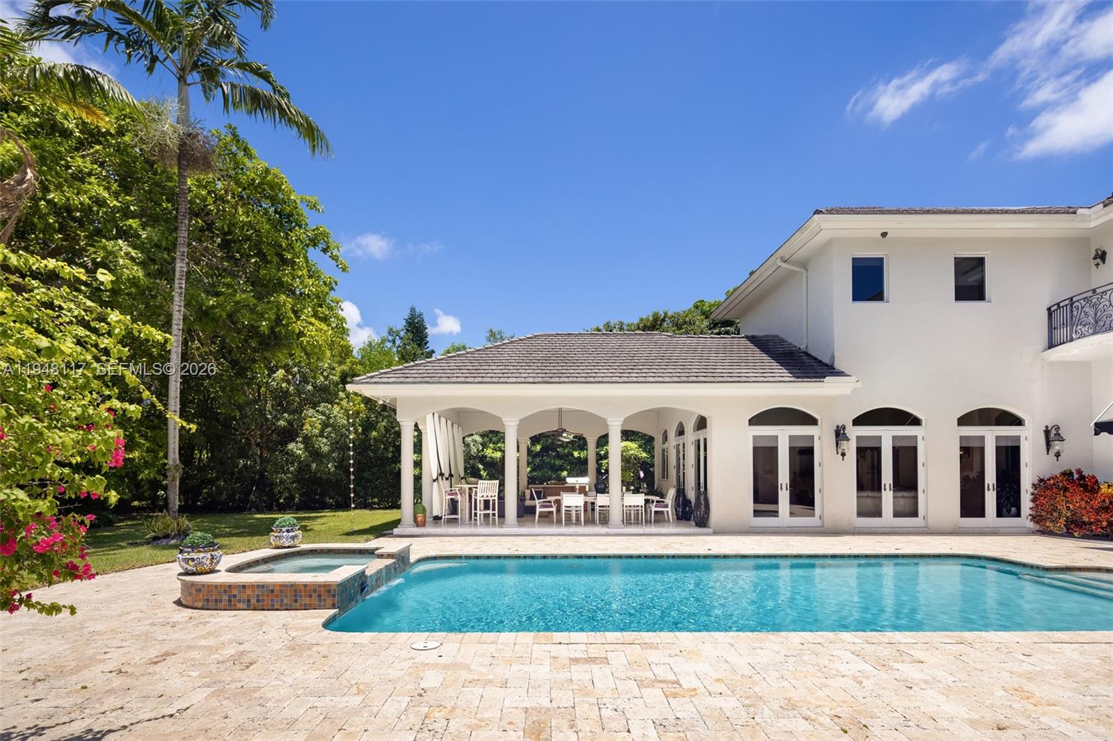 8252 School House Road Miami, FL 33143 - Photo 32 of 43 a view of house with garden and swimming pool