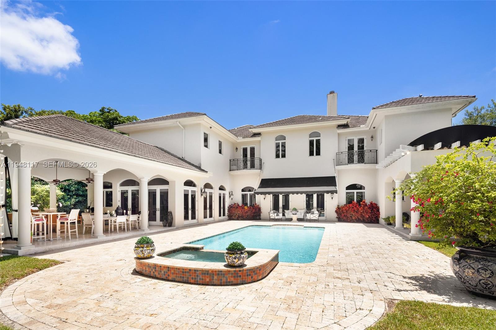 8252 School House Road Miami, FL 33143 - Photo 36 of 43 a front view of a house with a yard