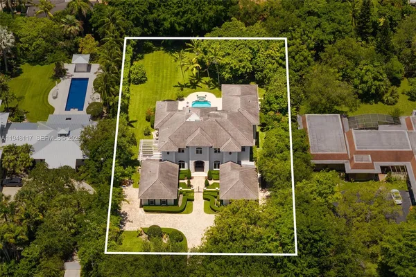 an aerial view of house with a swimming pool