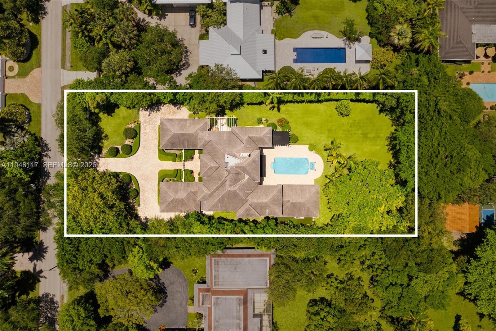 8252 School House Road Miami, FL 33143 - Photo 41 of 43 an aerial view of houses with a swimming pool