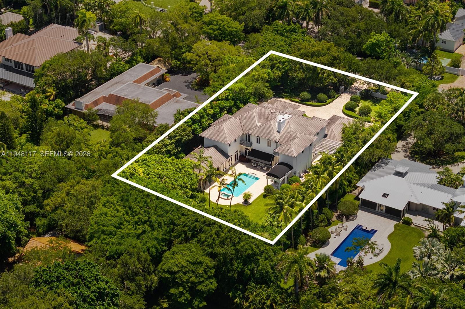 8252 School House Road Miami, FL 33143 - Photo 42 of 43 an aerial view of house with a swimming pool and outdoor space