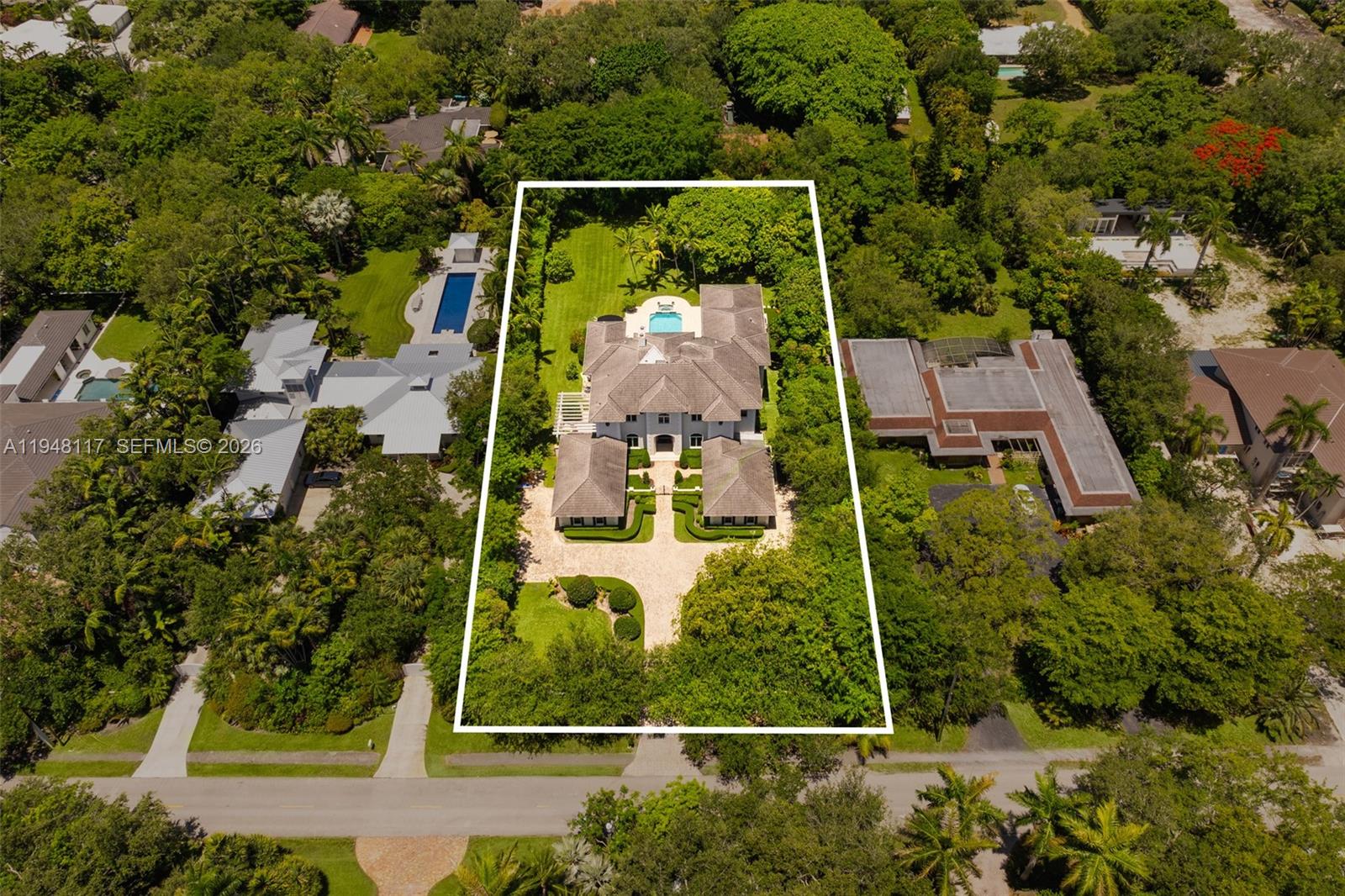 8252 School House Road Miami, FL 33143 - Photo 43 of 43 an aerial view of a house with a yard