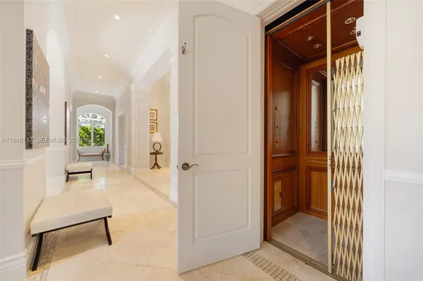 a view of a livingroom and a dining room with wooden floor