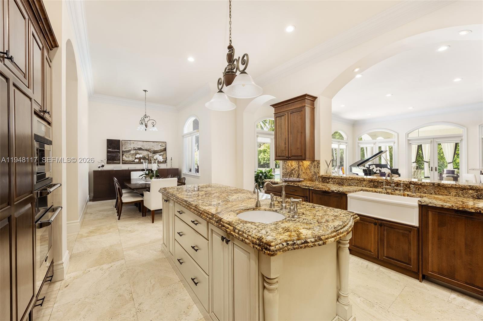 8252 School House Road Miami, FL 33143 - Photo 9 of 43 a kitchen with a sink stove and cabinets