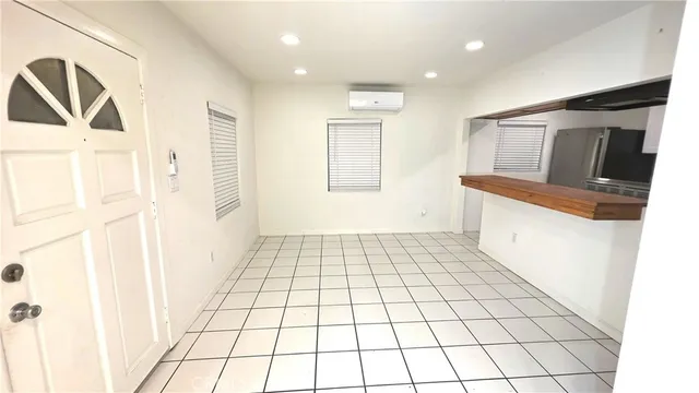 a view of a hallway with bathroom