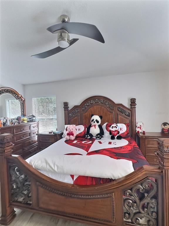 410 Maple Pointe Drive Seffner, FL 33584 - Photo 8 of 10 a room with a bed and glass windows