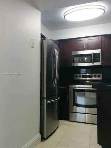 a view of a hallway with wooden shelves