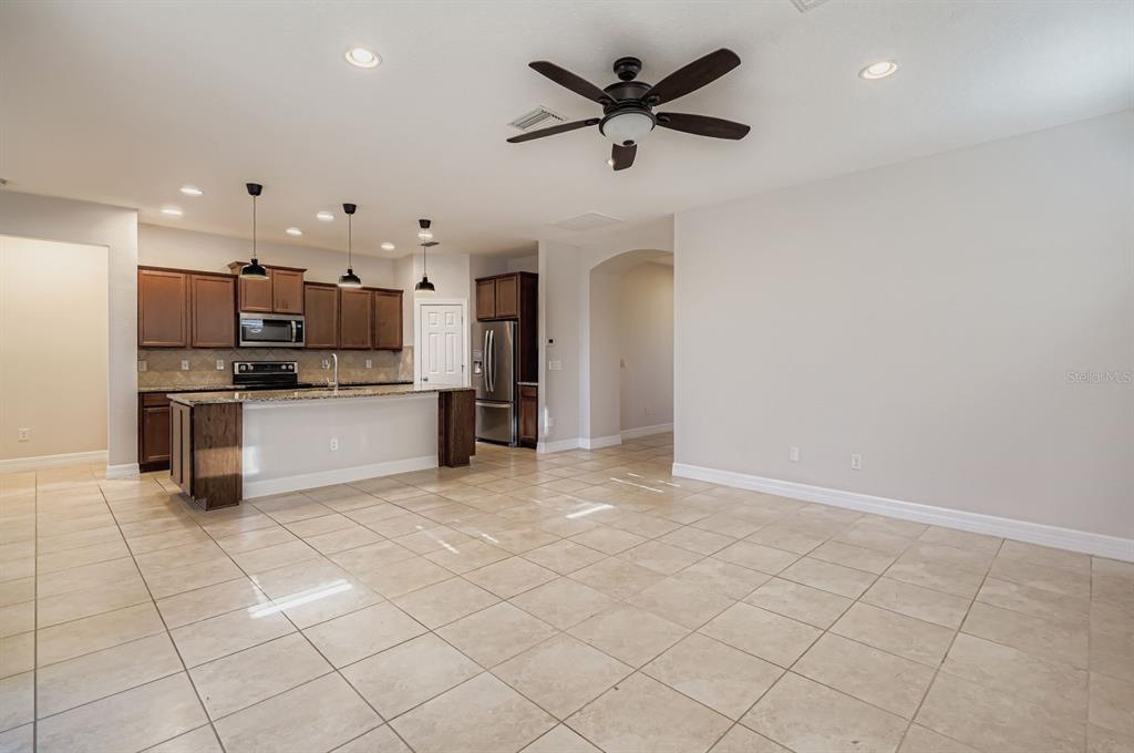 16355 Treasure Point Drive Wimauma, FL 33598 - Photo 14 of 28 a view of kitchen with microwave and cabinets