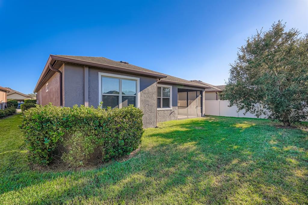 16355 Treasure Point Drive Wimauma, FL 33598 - Photo 2 of 28 a view of a house with a yard