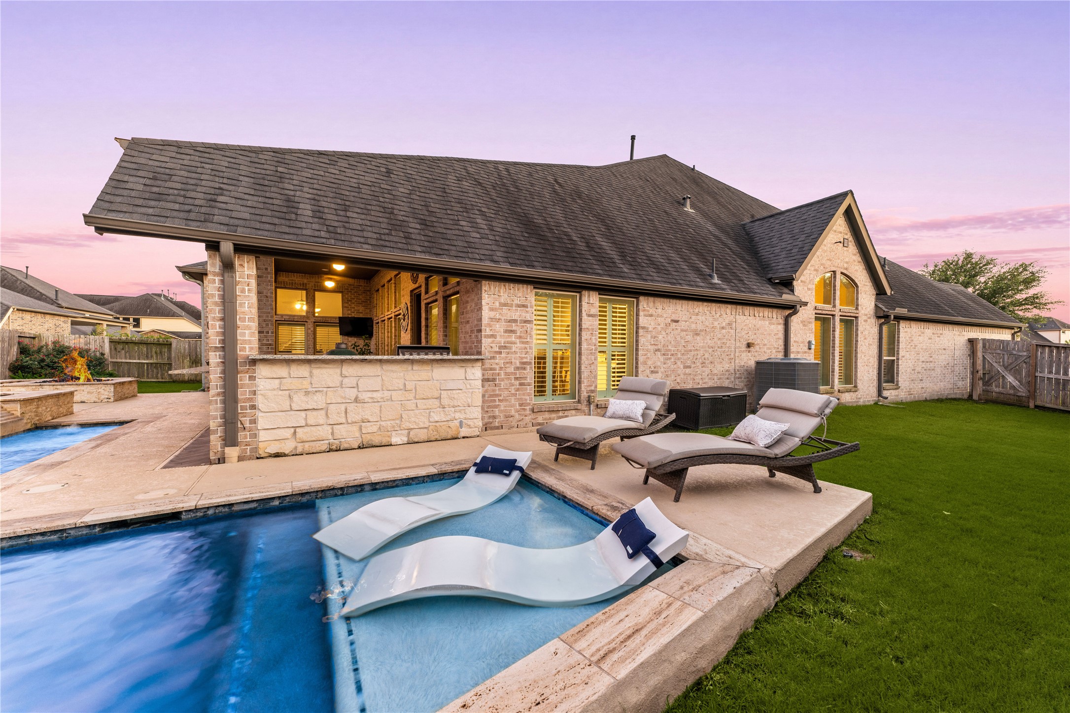 4103 August Light Court Fulshear, TX 77441 - Photo 26 of 33 a backyard of a house with table and chairs