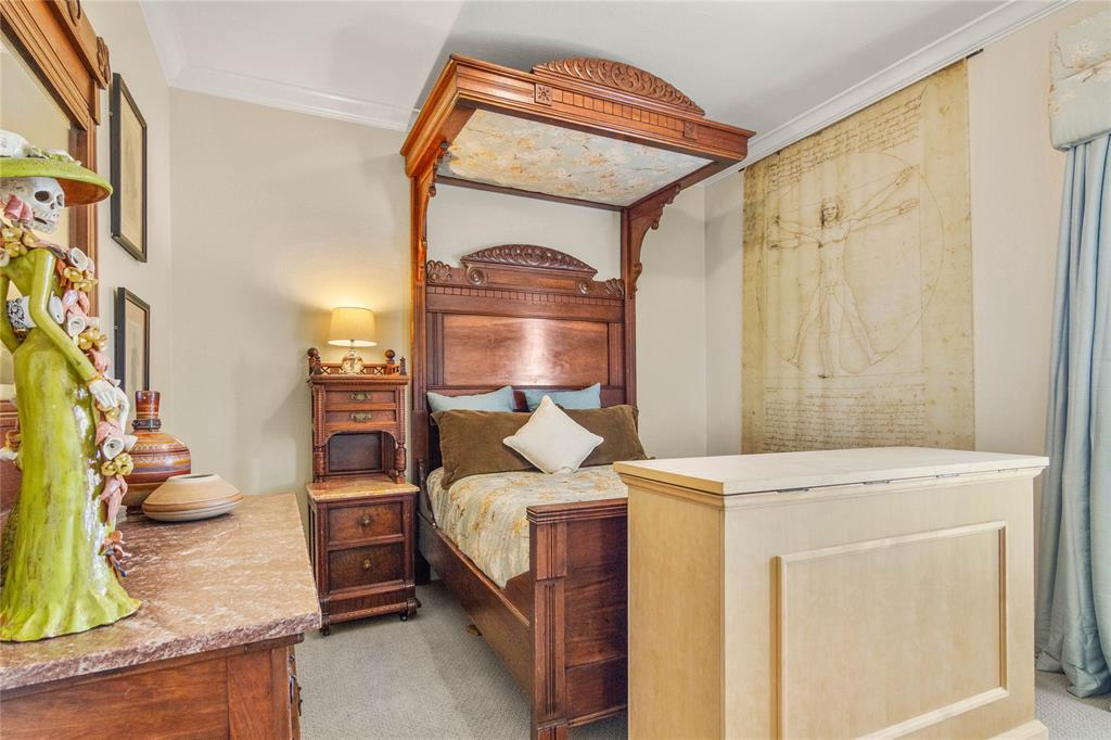 40 Enclave Court Waco, TX 76708 - Photo 21 of 40 a bedroom with a bed and a mirror