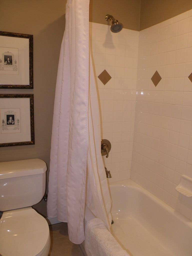 156 Plantation Road Gray, GA 31032 - Photo 22 of 48 a bathroom with a toilet and a shower