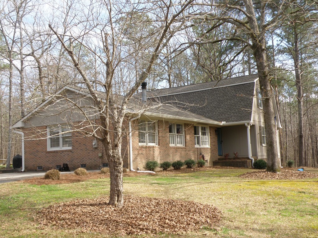 156 Plantation Road Gray, GA 31032 - Photo 44 of 48 a front view of a house with a garden