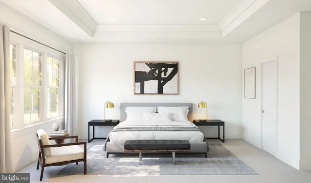 a bedroom with furniture and a window