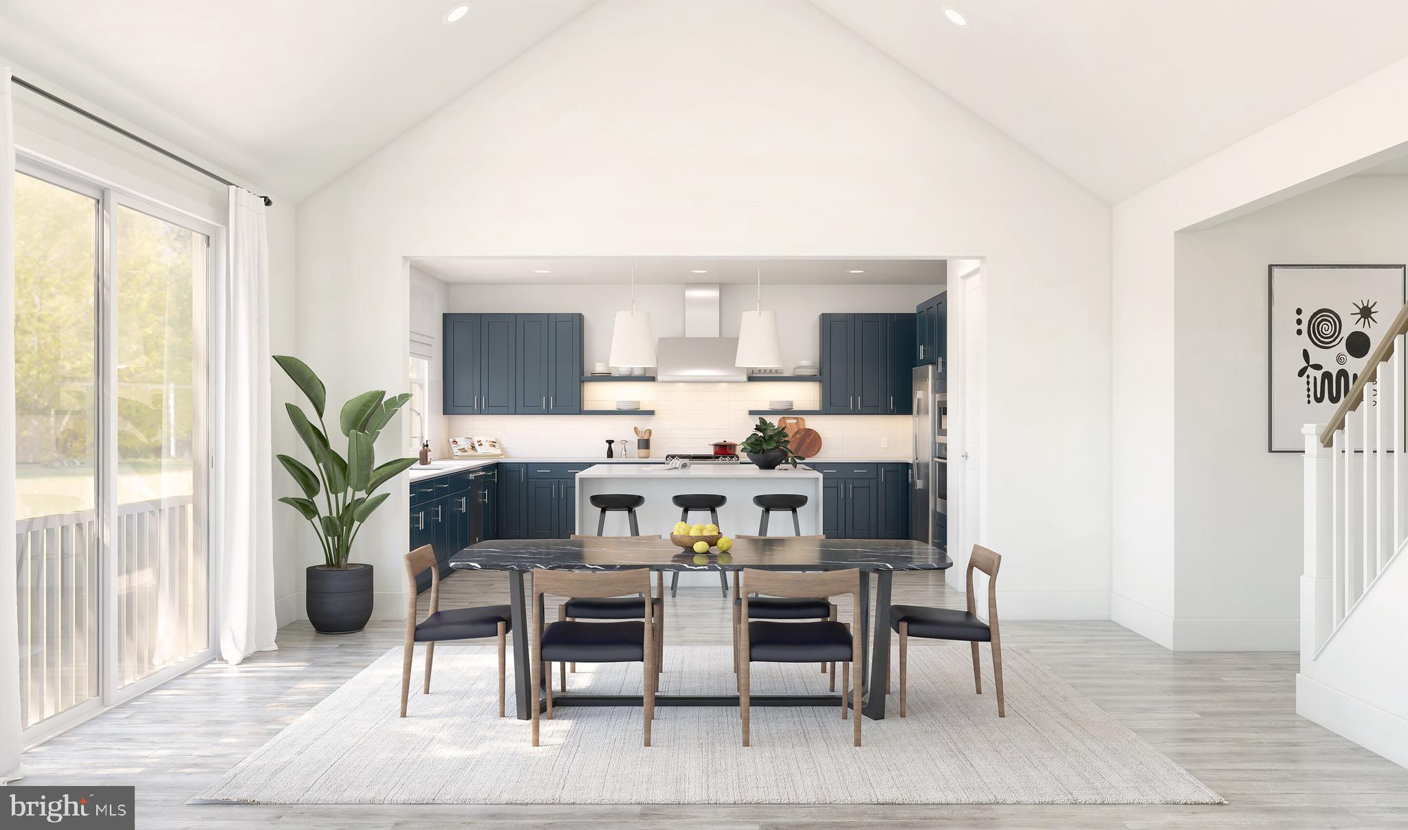 844 Merlin Drive Middletown, DE 19709 - Photo 2 of 17 a view of a dining room with furniture and a potted plant