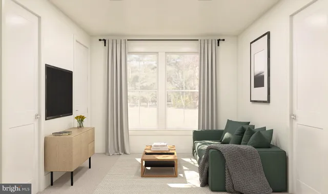 a bedroom with furniture and a flat screen tv