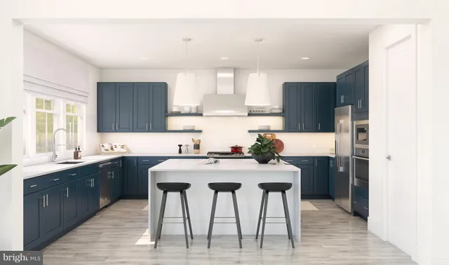a kitchen with a table chairs sink and cabinets