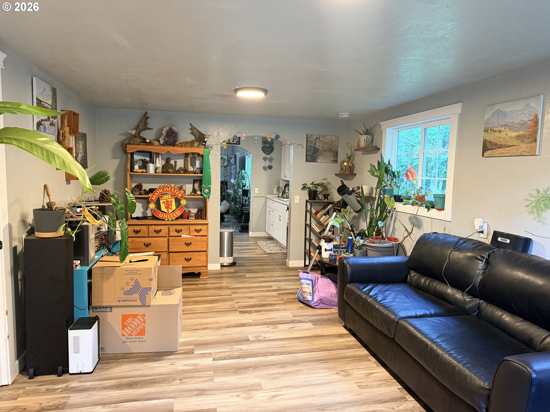 677 Southeast Moffitt Road Waldport, OR 97394 - Photo 7 of 36 a living room with furniture and wooden floor