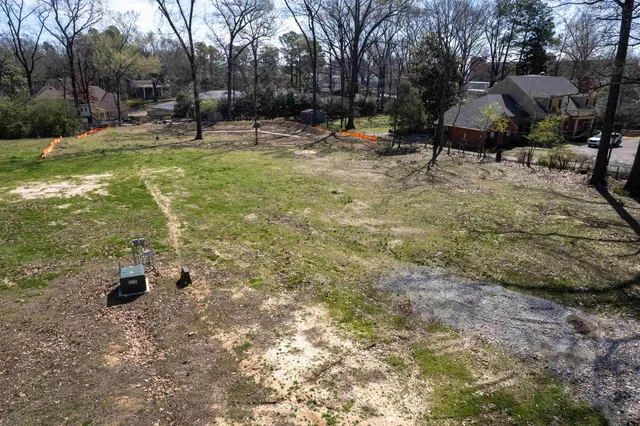 a backyard of a house with lots of green space