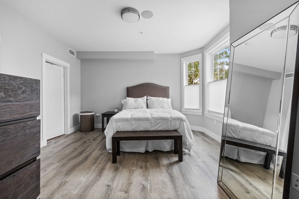 176 Humboldt Avenue, Unit 2 Boston, MA 02121 - Photo 11 of 23 a bedroom with a bed and a table