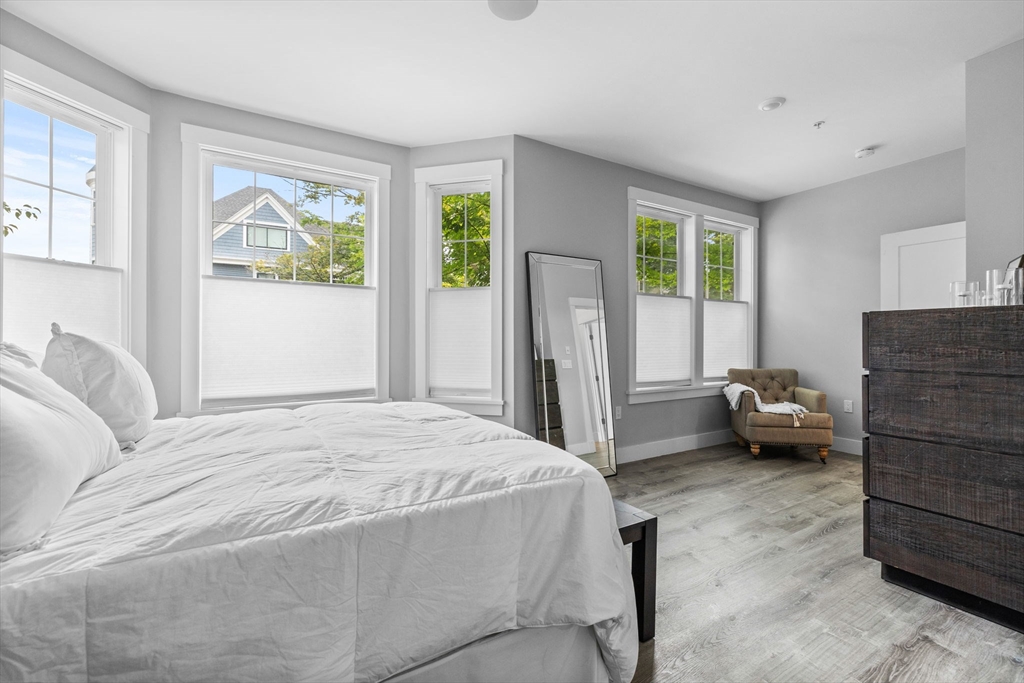 176 Humboldt Avenue, Unit 2 Boston, MA 02121 - Photo 14 of 23 a bedroom with a bed and a window