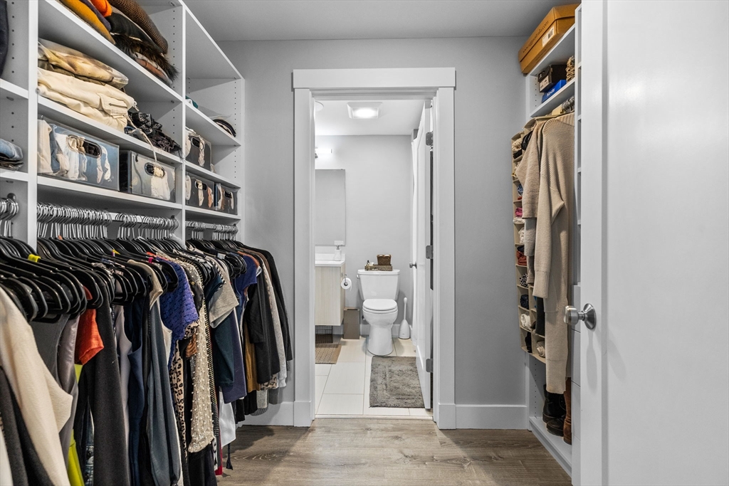 176 Humboldt Avenue, Unit 2 Boston, MA 02121 - Photo 15 of 23 a view of walk in closet with clothes and shoes