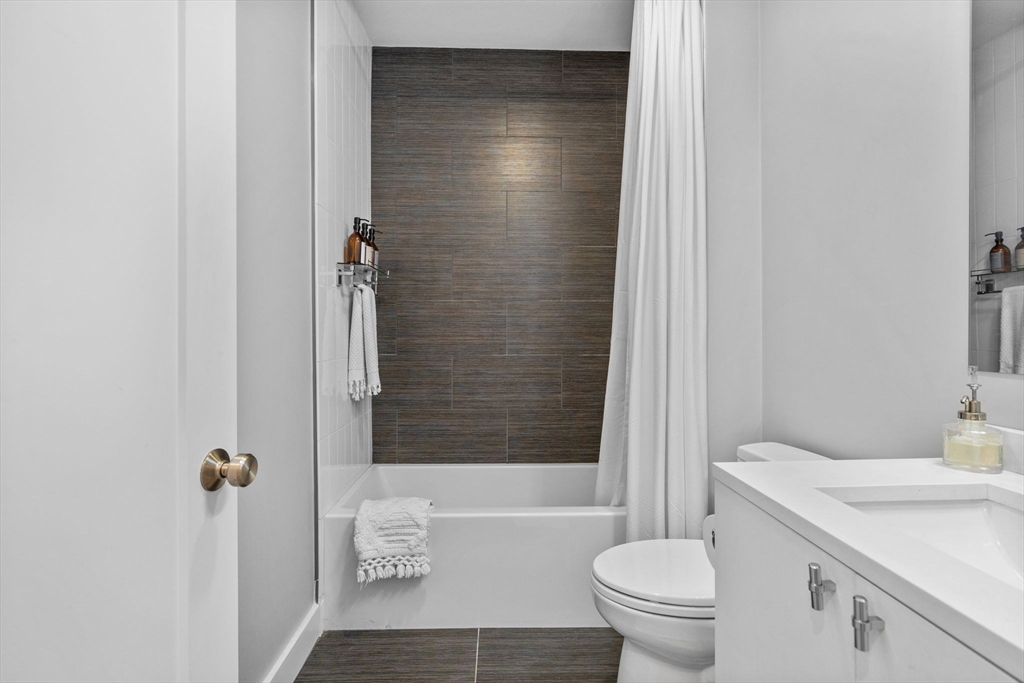 176 Humboldt Avenue, Unit 2 Boston, MA 02121 - Photo 19 of 23 a bathroom with a sink a toilet and shower