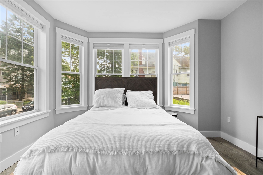176 Humboldt Avenue, Unit 2 Boston, MA 02121 - Photo 9 of 23 a bedroom with a large bed and a large window
