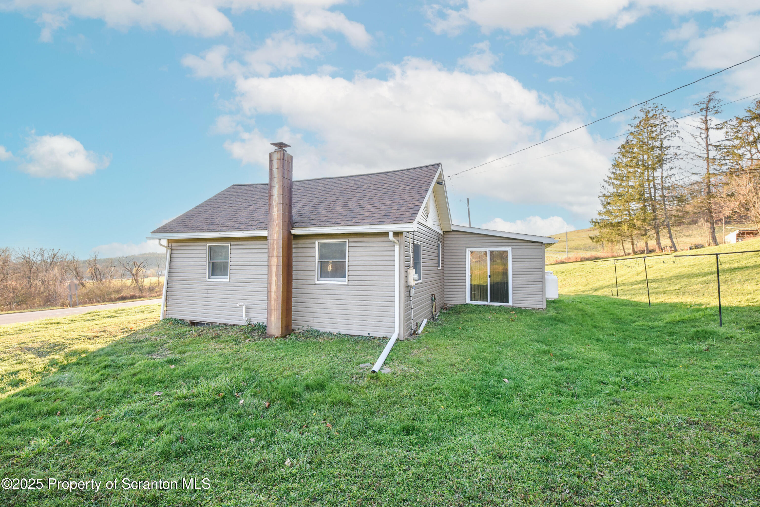 6193 Highway 87 Tunkhannock, PA 18657 - Photo 12 of 41 a view of a house with a yard and pathway