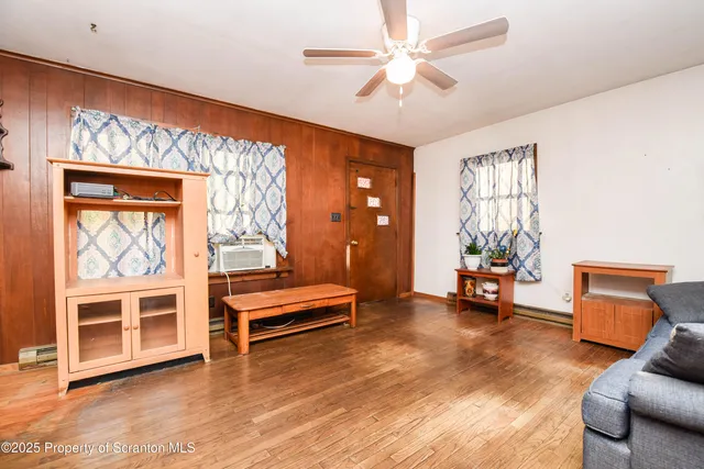 a view of livingroom with furniture and windows