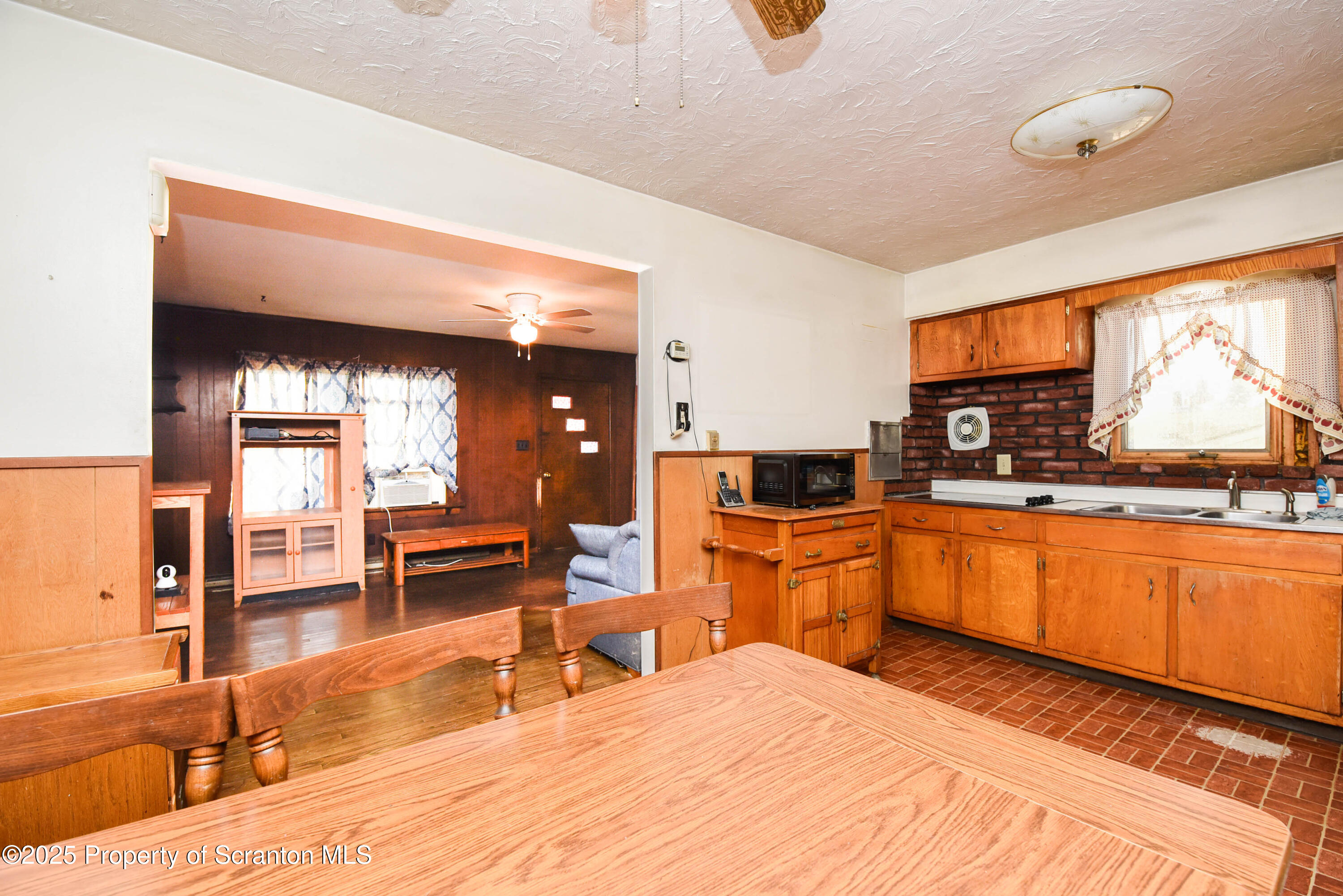6193 Highway 87 Tunkhannock, PA 18657 - Photo 19 of 41 a large kitchen with stainless steel appliances kitchen island granite countertop a large sink and cabinets