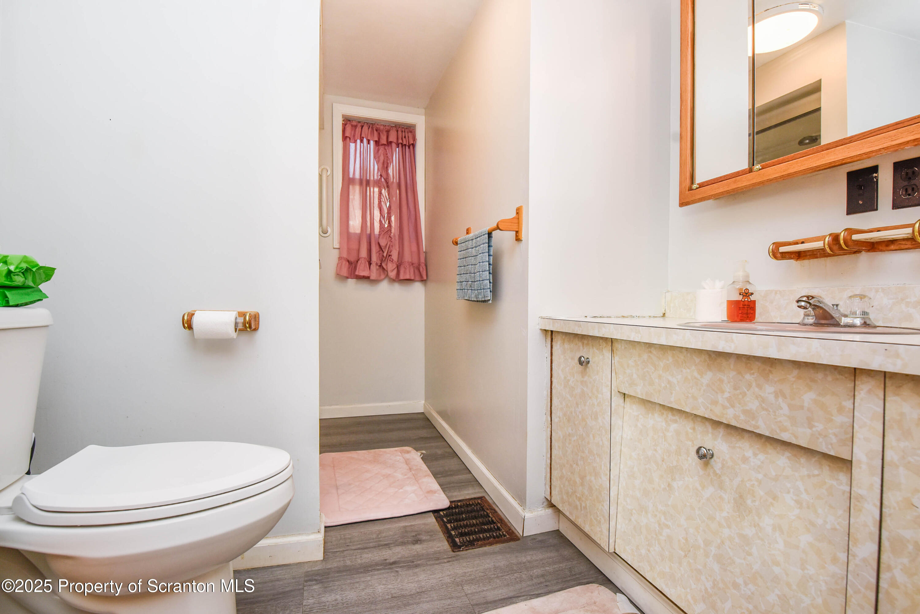 6193 Highway 87 Tunkhannock, PA 18657 - Photo 27 of 41 a bathroom with a toilet and a shower curtain