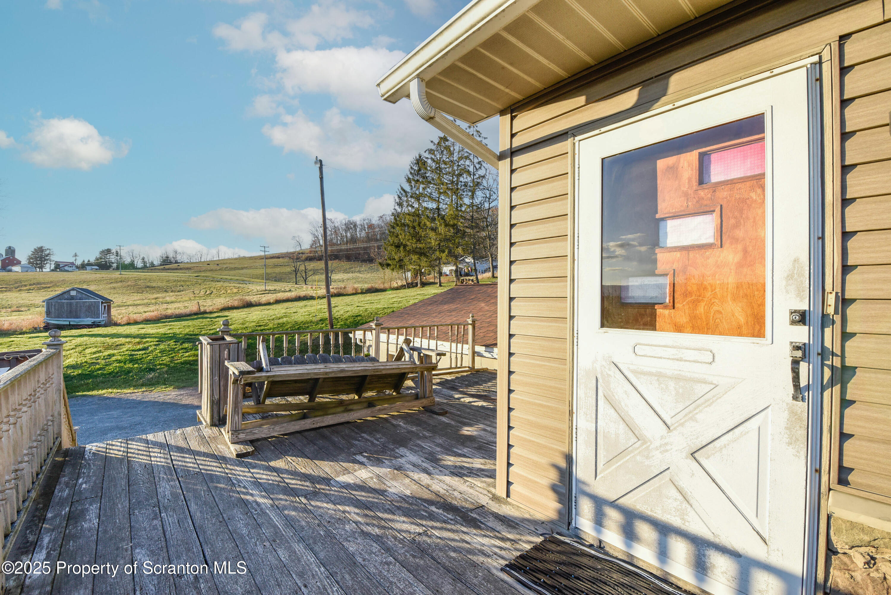 6193 Highway 87 Tunkhannock, PA 18657 - Photo 7 of 41 a view of a swimming pool with outdoor seating and a ocean view
