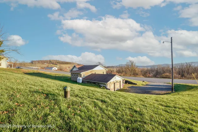a view of a houses with a big yard