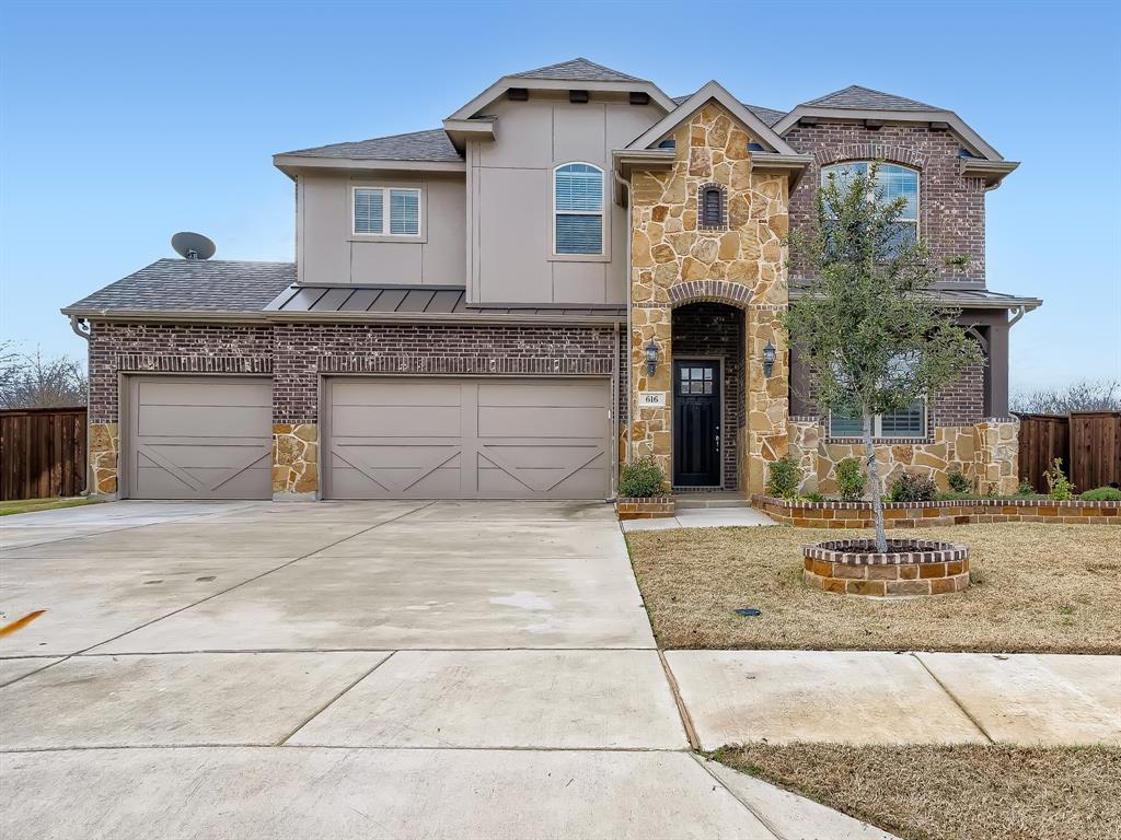 616 Shoreline Ridge Drive Little Elm, TX 75068 - Photo 1 of 1 a front view of a house with a garden