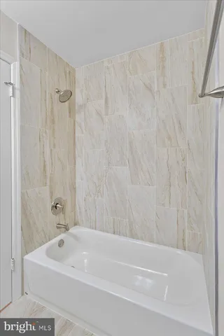 a bathroom with a white bath tub